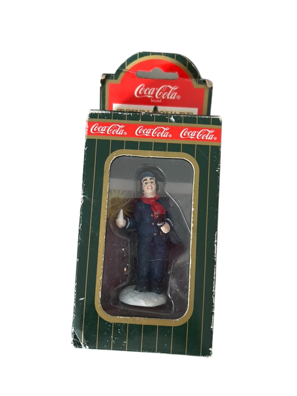 Coca-Cola Mailman Figure in Green Coat with Red Hat Accent
